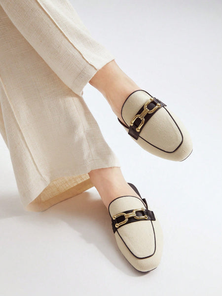 FLAT MULES WITH METAL BUCKLE DETAIL